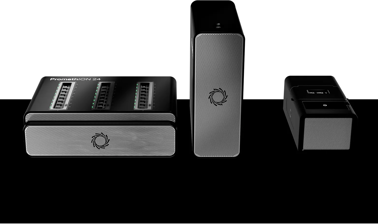 PromethION 24  with compute tower and PromethION Integrated sequencing devices next to each other on a black background