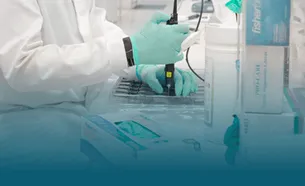 A scientist loading a flow cell